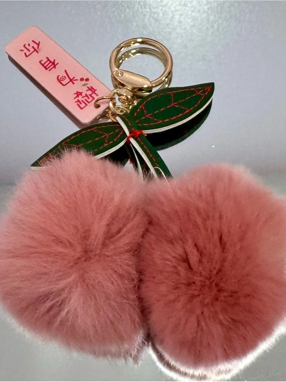 New Pink Faux Fur Pom Pom Cherry Keychain with Green Leaf Accent